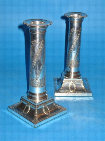A Pair of George III Candlesticks, possibly by Winter & Co., circa 1785. - Click to enlarge and for full details.